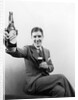 1920s 1930s Man Holding Up Huge Distorted Beer Bottle In One Hand And A Regular Size Glass Of Beer In Other by Anonymous
