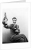 1920s 1930s Man Holding Up Huge Distorted Beer Bottle In One Hand And A Regular Size Glass Of Beer In Other by Anonymous