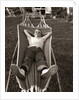 1950s Relaxed Boy Lying In Suburban Backyard Hammock by Anonymous