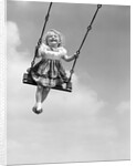 1950s Laughing Little Girl Swinging High On Outdoor Swing by Anonymous