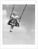 1950s Laughing Little Girl Swinging High On Outdoor Swing by Anonymous