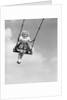 1950s Laughing Little Girl Swinging High On Outdoor Swing by Anonymous