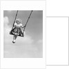 1950s Laughing Little Girl Swinging High On Outdoor Swing by Anonymous