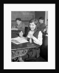 1920s School Girl Eating Lunch At Her Desk Drinking From A Bottle Of Milk Holding A Sandwich by Anonymous