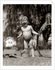 1940s 1950s Wet Young Boy Toddler Outside Playing With Water Hose by Anonymous