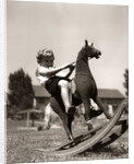 Little Boy on Rocking Horse Toy by Anonymous