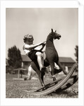 Little Boy on Rocking Horse Toy by Anonymous