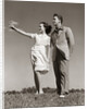 1940s Teenage Couple Standing Together Outdoors Girl Pointing by Anonymous