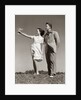 1940s Teenage Couple Standing Together Outdoors Girl Pointing by Anonymous