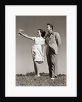 1940s Teenage Couple Standing Together Outdoors Girl Pointing by Anonymous