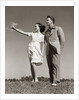 1940s Teenage Couple Standing Together Outdoors Girl Pointing by Anonymous