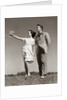 1940s Teenage Couple Standing Together Outdoors Girl Pointing by Anonymous