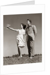 1940s Teenage Couple Standing Together Outdoors Girl Pointing by Anonymous