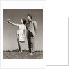 1940s Teenage Couple Standing Together Outdoors Girl Pointing by Anonymous