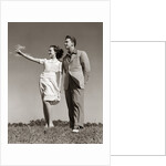 1940s Teenage Couple Standing Together Outdoors Girl Pointing by Anonymous