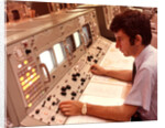 1970s Man Sitting At Control Panel Of NASA Mission Control by Anonymous