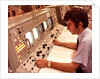 1970s Man Sitting At Control Panel Of NASA Mission Control by Anonymous
