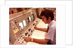 1970s Man Sitting At Control Panel Of NASA Mission Control by Anonymous