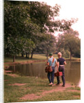 1970s 1960s Two Boys Walking Beside Fishing Pond by Anonymous