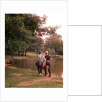 1970s 1960s Two Boys Walking Beside Fishing Pond by Anonymous