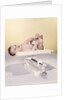 1950s 1960s Baby Lying On Weight Scale by Anonymous