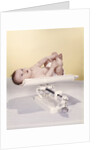 1950s 1960s Baby Lying On Weight Scale by Anonymous