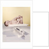 1950s 1960s Baby Lying On Weight Scale by Anonymous