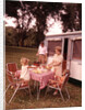 1960s Family Rv Camping Father Grilling Mother And Girls Setting Table by Anonymous