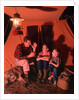 1960s 1970s Grandfather Telling Scary Story To Boys By Tent At Night Campsite In Shadows by Anonymous