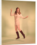 1960s Woman Dancer In Tan Dress And Boots White Fishnet Stockings by Anonymous