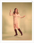 1960s Woman Dancer In Tan Dress And Boots White Fishnet Stockings by Anonymous