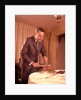 1960s Well-Dressed Man Carving Roast Beef At Dinner Table by Anonymous