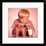 1950s 1960s Boy Drinking Three Milkshakes Through A Straw At Same Time by Anonymous