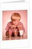1950s 1960s Boy Drinking Three Milkshakes Through A Straw At Same Time by Anonymous