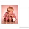 1950s 1960s Boy Drinking Three Milkshakes Through A Straw At Same Time by Anonymous
