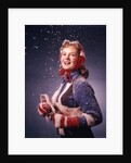1960s Young Woman Wearing Red Mittens Ear Muffs Blue Sweater Holding Ice Skates In Falling Snow by Anonymous