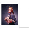 1960s Young Woman Wearing Red Mittens Ear Muffs Blue Sweater Holding Ice Skates In Falling Snow by Anonymous