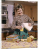 1960s Woman Housewife Mother Wearing Apron In Kitchen Pouring Milk Into Thermos For School Lunch by Anonymous