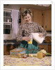 1960s Woman Housewife Mother Wearing Apron In Kitchen Pouring Milk Into Thermos For School Lunch by Anonymous