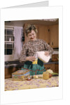 1960s Woman Housewife Mother Wearing Apron In Kitchen Pouring Milk Into Thermos For School Lunch by Anonymous