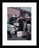 1950s Family Mother Father Daughter In Front Of Suburban House Packing Luggage In Car For Vacation by Anonymous