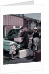 1950s Family Mother Father Daughter In Front Of Suburban House Packing Luggage In Car For Vacation by Anonymous