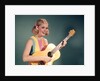 1960s Perky Young Teenager Folk Singer Playing Guitar by Anonymous