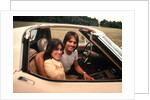 1970s Young Couple Man Woman Sitting Cockpit Of Chevrolet Corvette Car Sports by Anonymous