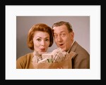 1960s Surprised Happy Couple Man Woman With Grocery Bag Filled With Money by Anonymous