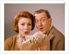 1960s Surprised Happy Couple Man Woman With Grocery Bag Filled With Money by Anonymous