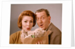 1960s Surprised Happy Couple Man Woman With Grocery Bag Filled With Money by Anonymous