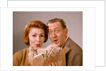1960s Surprised Happy Couple Man Woman With Grocery Bag Filled With Money by Anonymous
