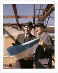 1960s Two Men With Blueprints At Construction Site by Anonymous