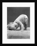 1940s Baby Bending Down With Head On Blanket by Anonymous